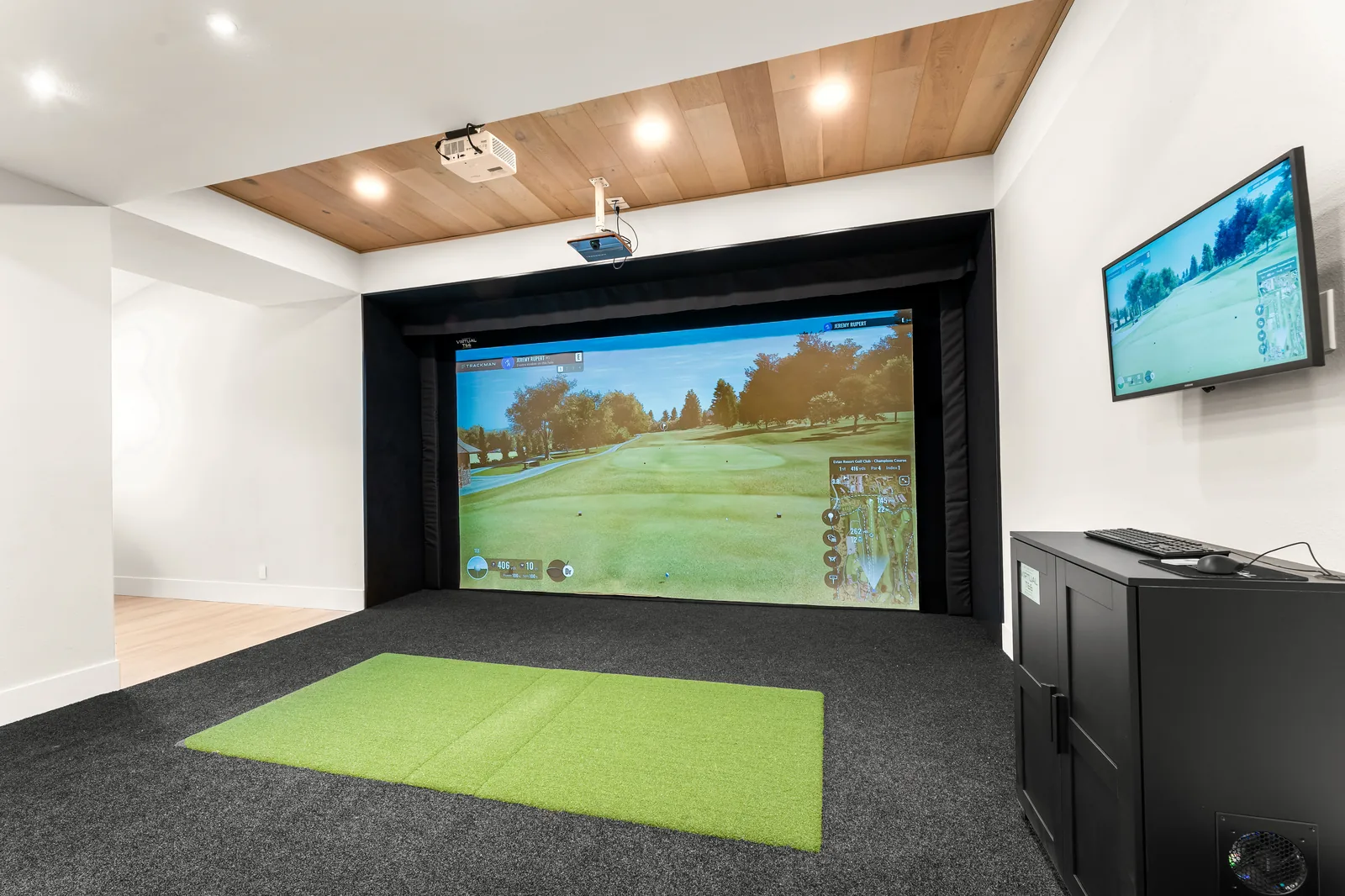 Custom home golf simulator with overhead recessed lighting design