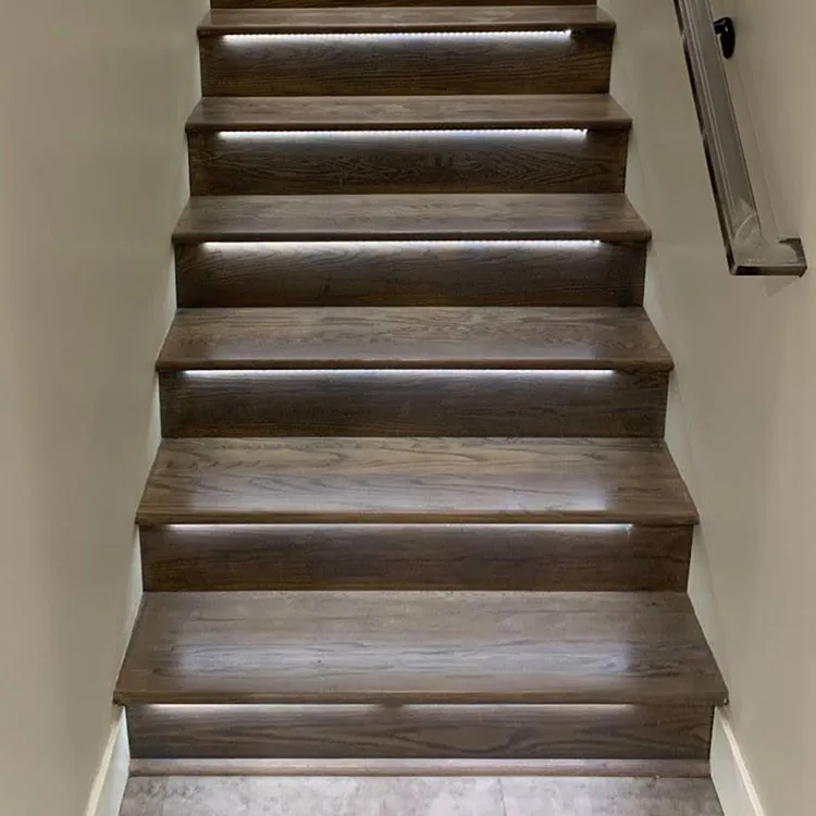 LED accent lighting installed on hardwood stair treads