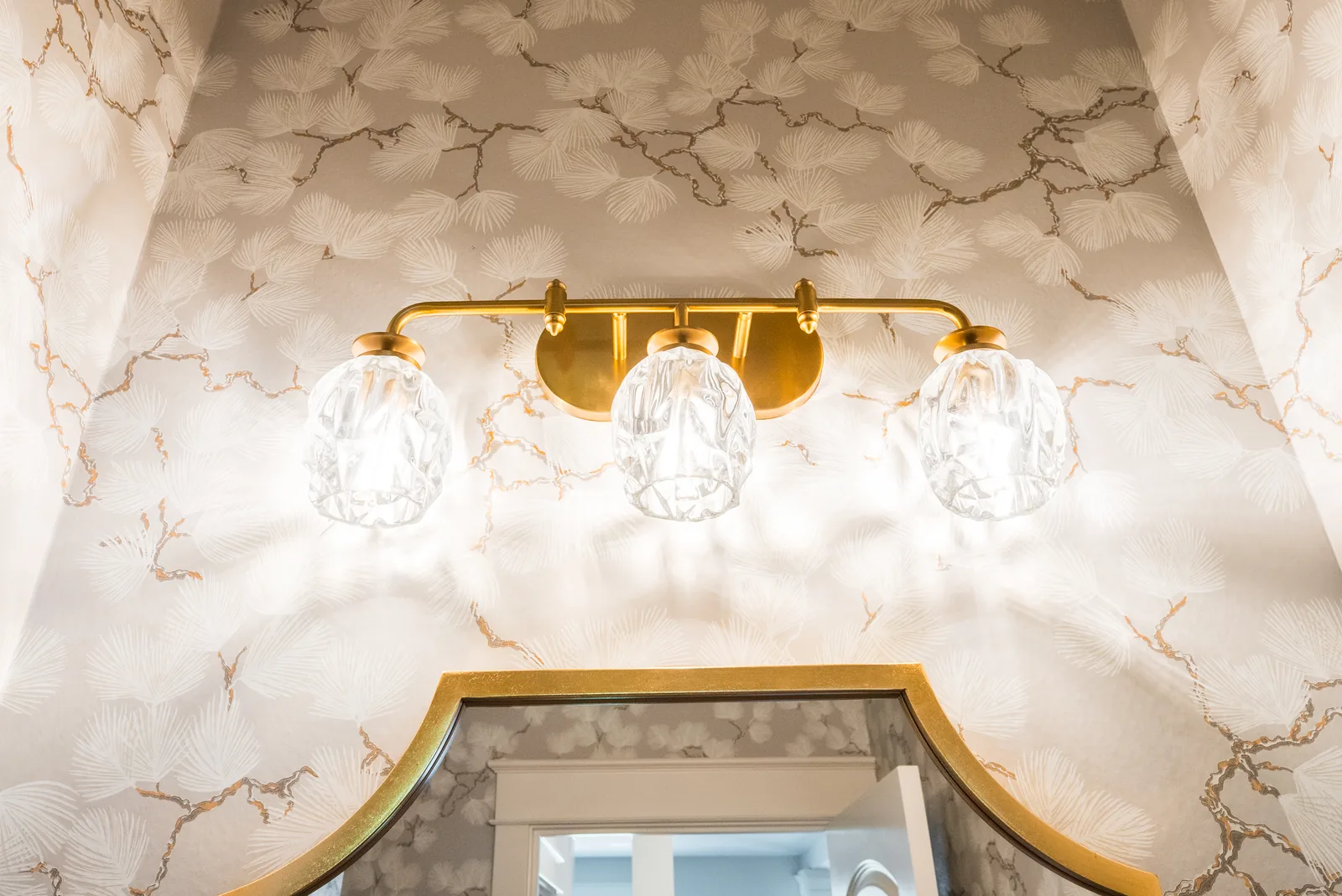 Custom vanity with gold pendant light fixture installation